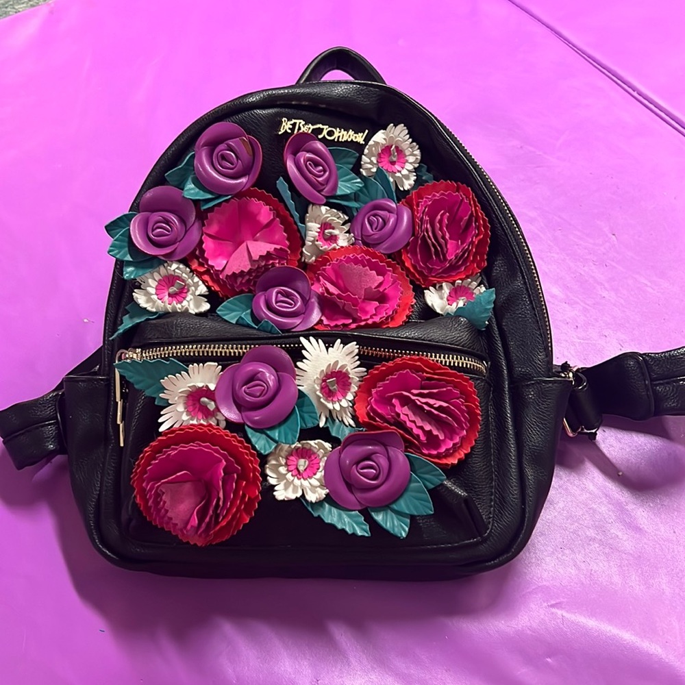 Betsey Johnson purse backpack. Black leather with flowers.